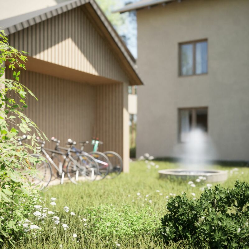 Außenbereich mit Fahrradunterstand und Gebäude