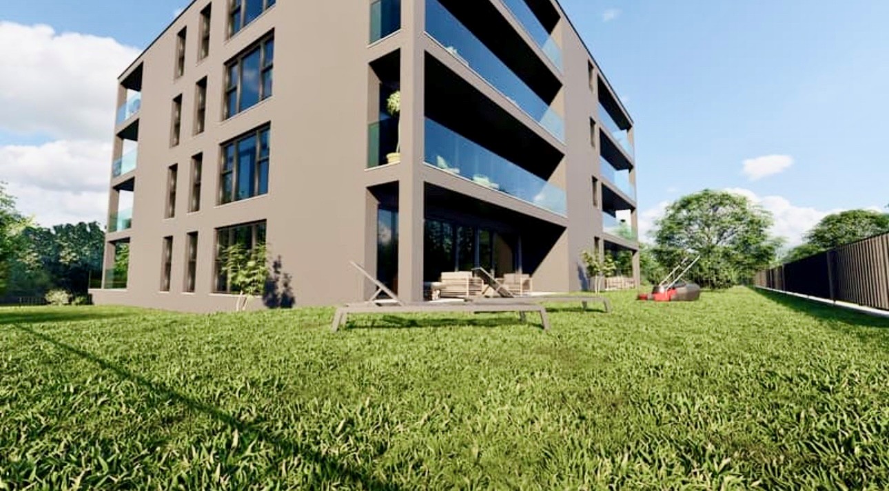 Moderner Wohnbau mit Garten