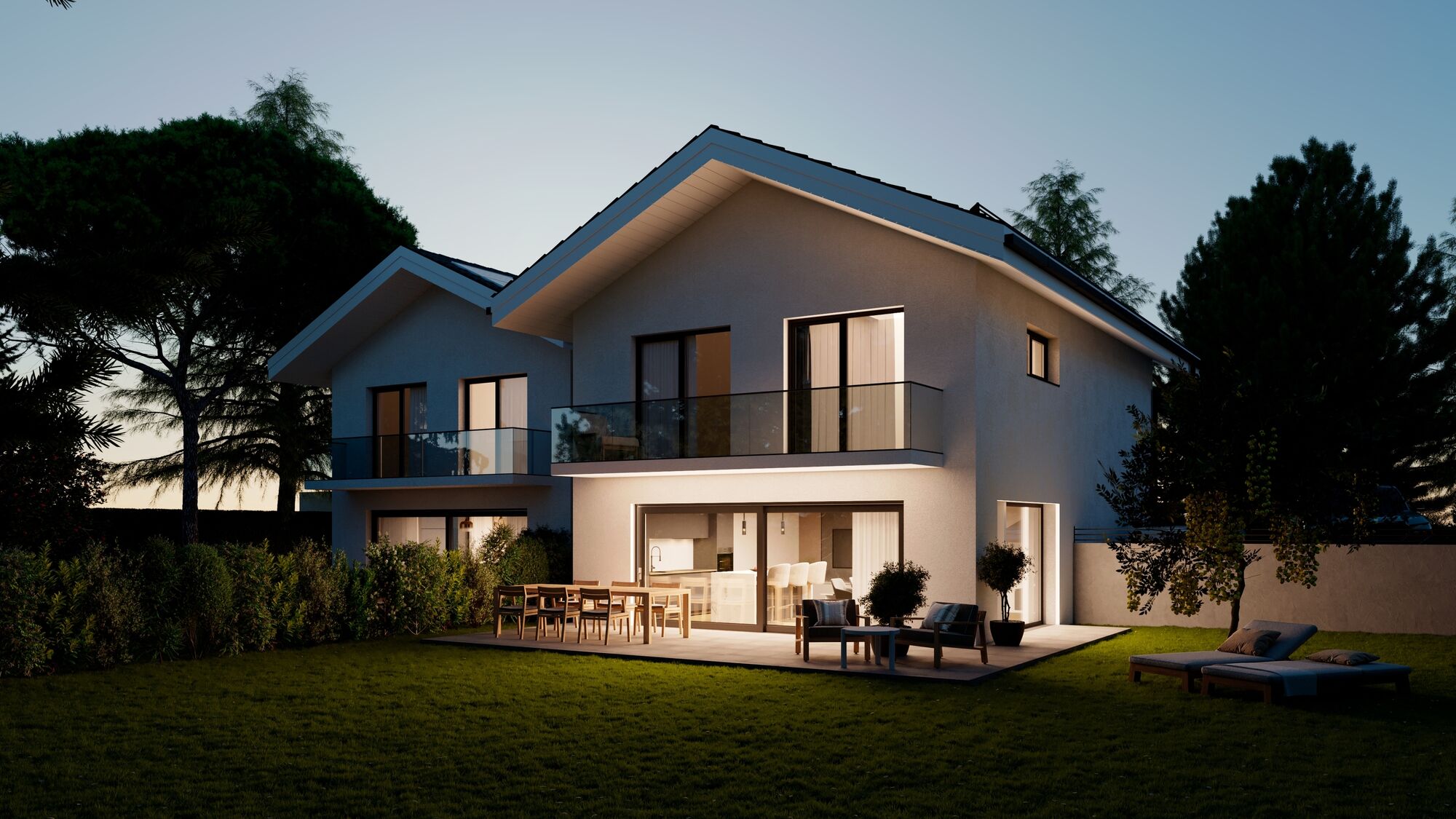 Modernes Einfamilienhaus mit Garten und Terrasse bei Abendlicht