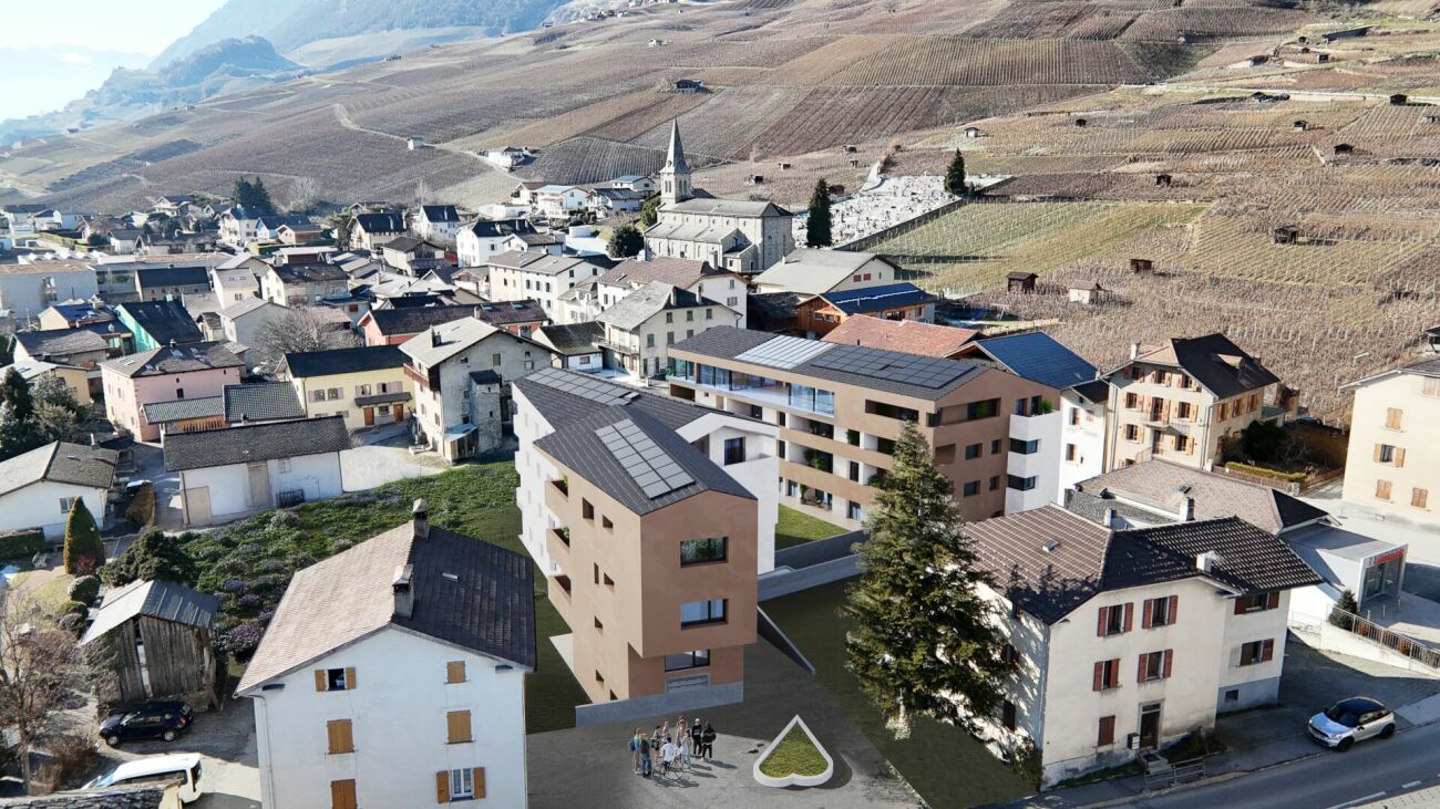 Luftaufnahme eines Dorfes in Hanglage