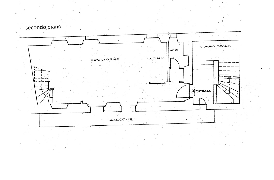 Grundriss eines Obergeschosses mit Balkon, Wohnzimmer, Küche, WC und Eingang