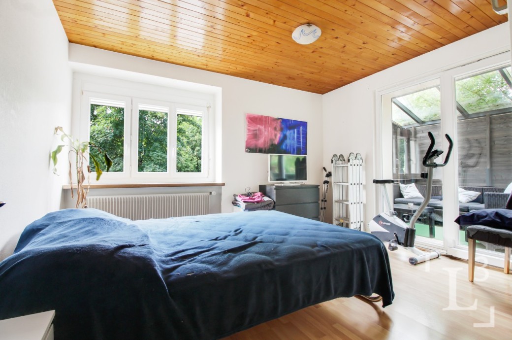 Schlafzimmer mit Wintergarten und Fitnessbereich