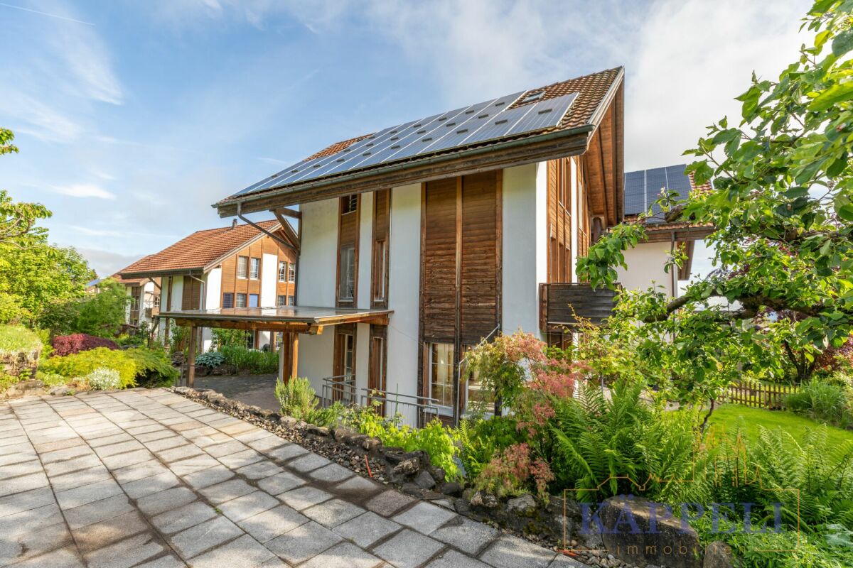 Solarhaus mit Gartenansicht