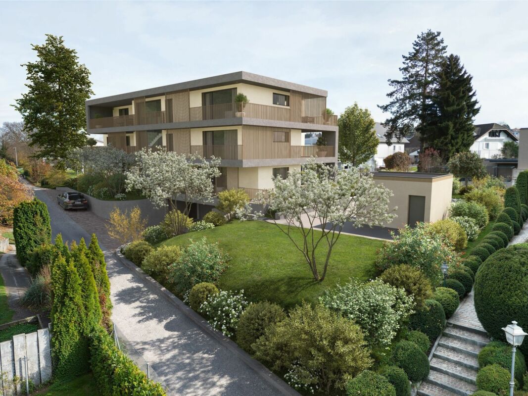 Modernes Mehrfamilienhaus mit gepflegtem Garten