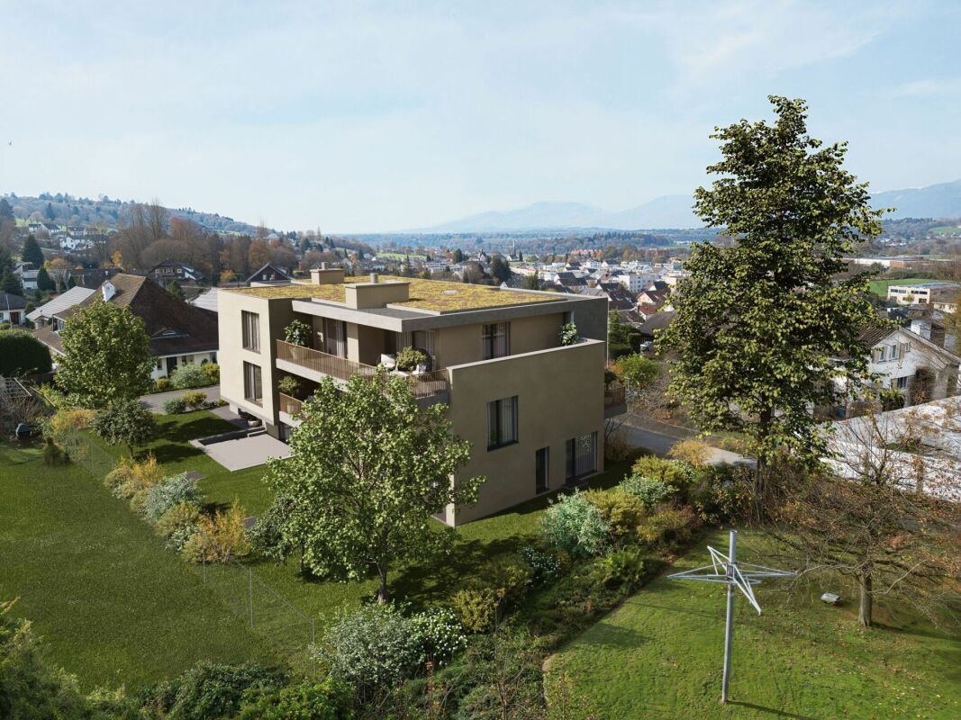 Modernes Wohnhaus mit Garten und Bergblick