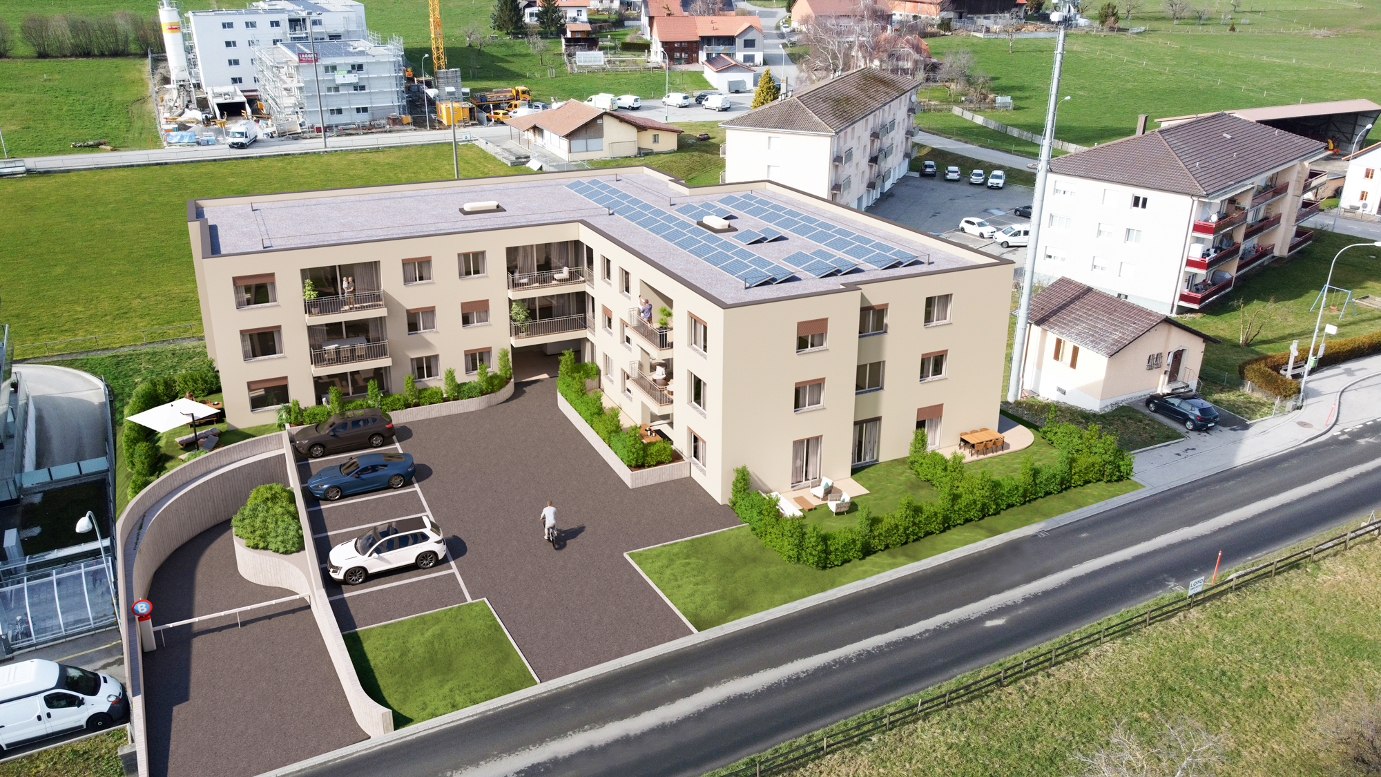 Luftaufnahme eines modernen Mehrfamilienhauses mit PV-Anlage