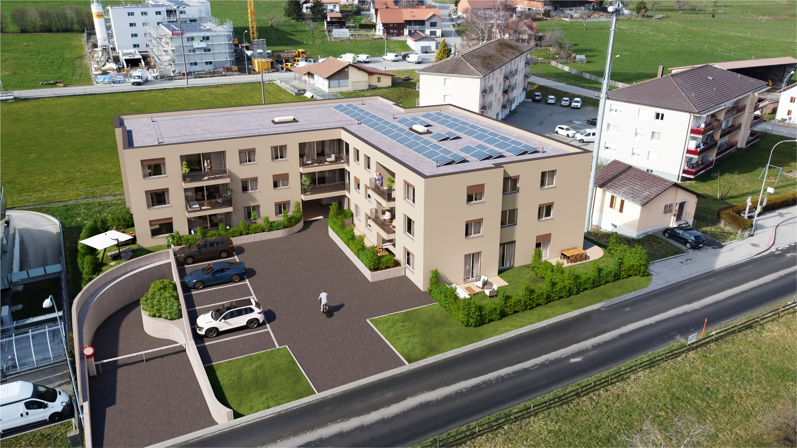 Luftaufnahme eines modernen Mehrfamilienhauses mit PV-Anlage
