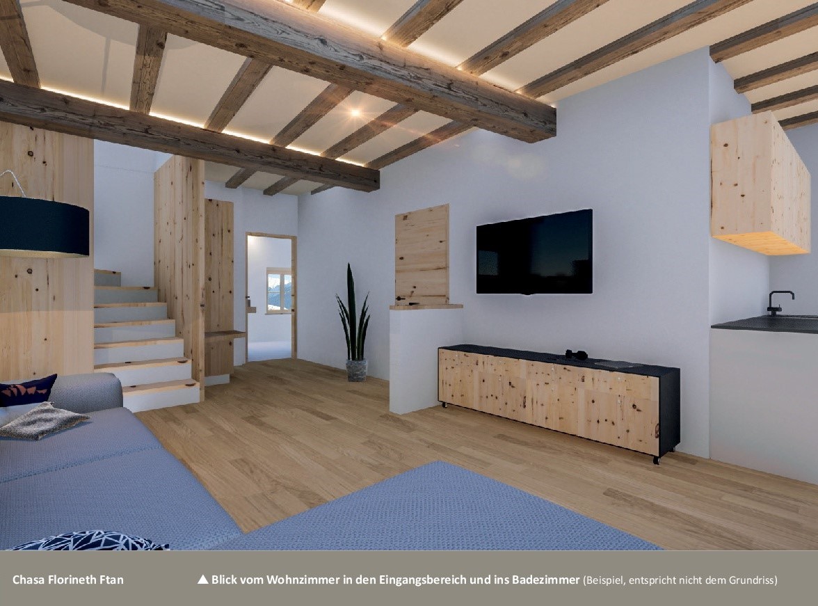 Wohnzimmer mit sichtbaren Holzbalken und offenem Grundriss