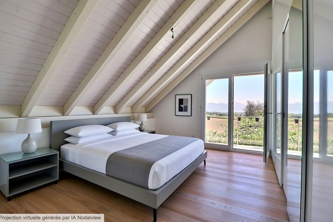 Dachgeschoss-Schlafzimmer mit Balkonblick