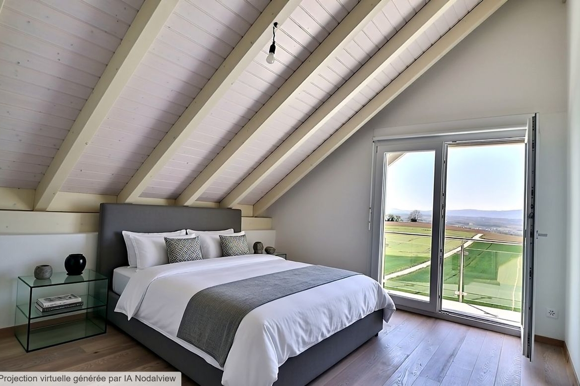 Schlafzimmer unter Dachschräge mit Balkonblick