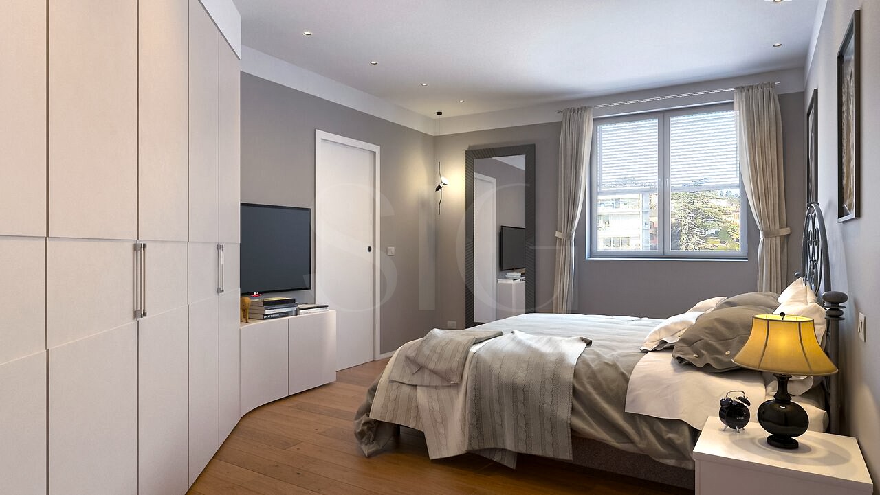 Modernes Schlafzimmer mit Einbauschrank und Fensterblick