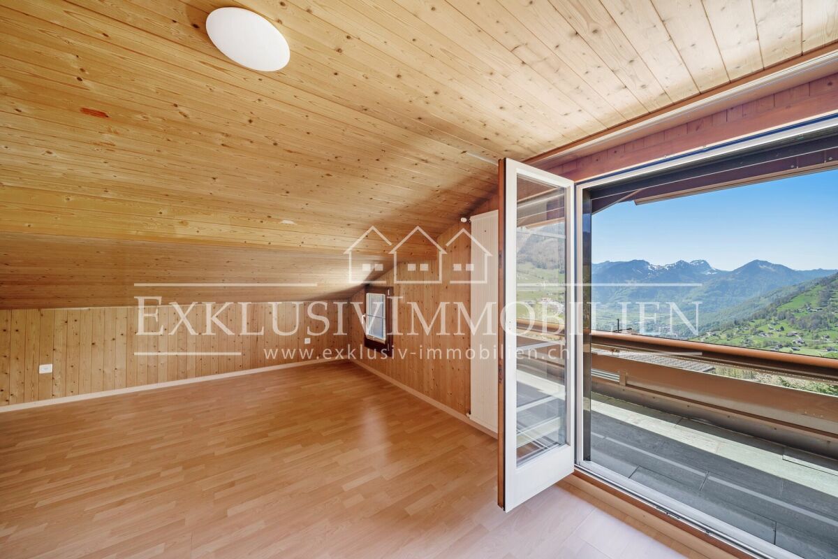 Dachgeschosszimmer mit Alpenblick
