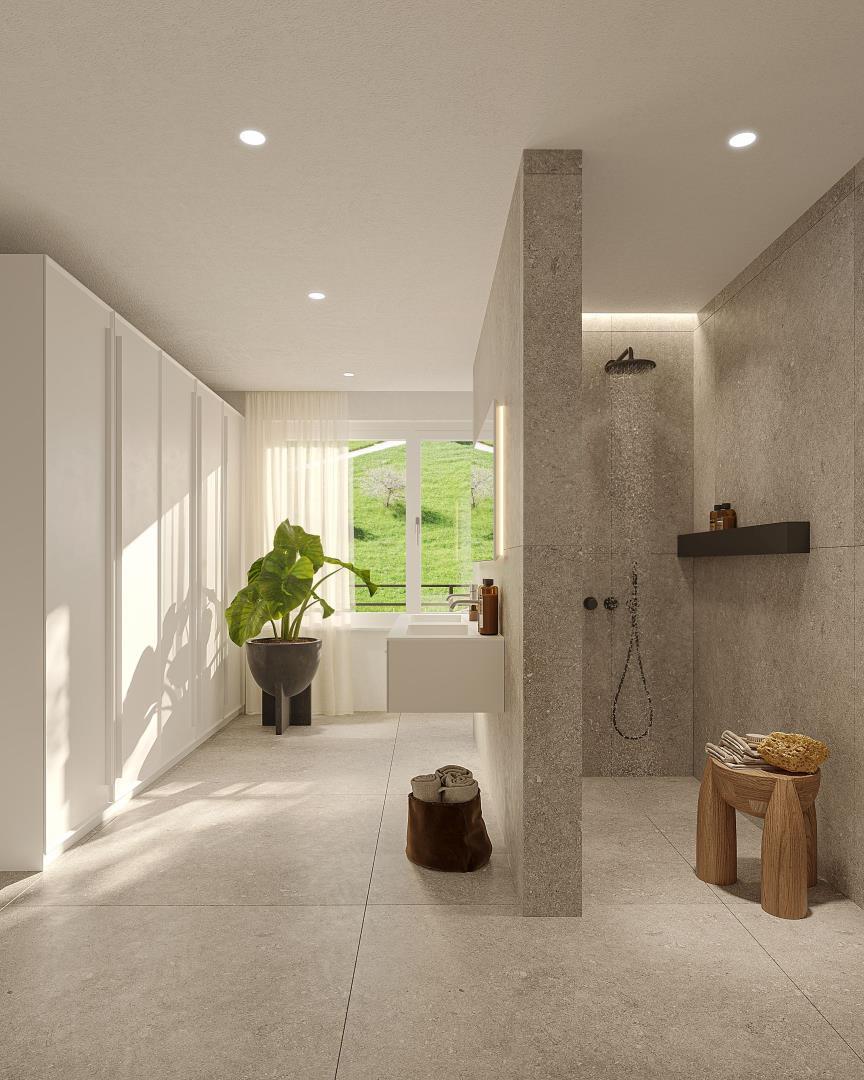 Modernes Bad mit Dusche und grünem Ausblick