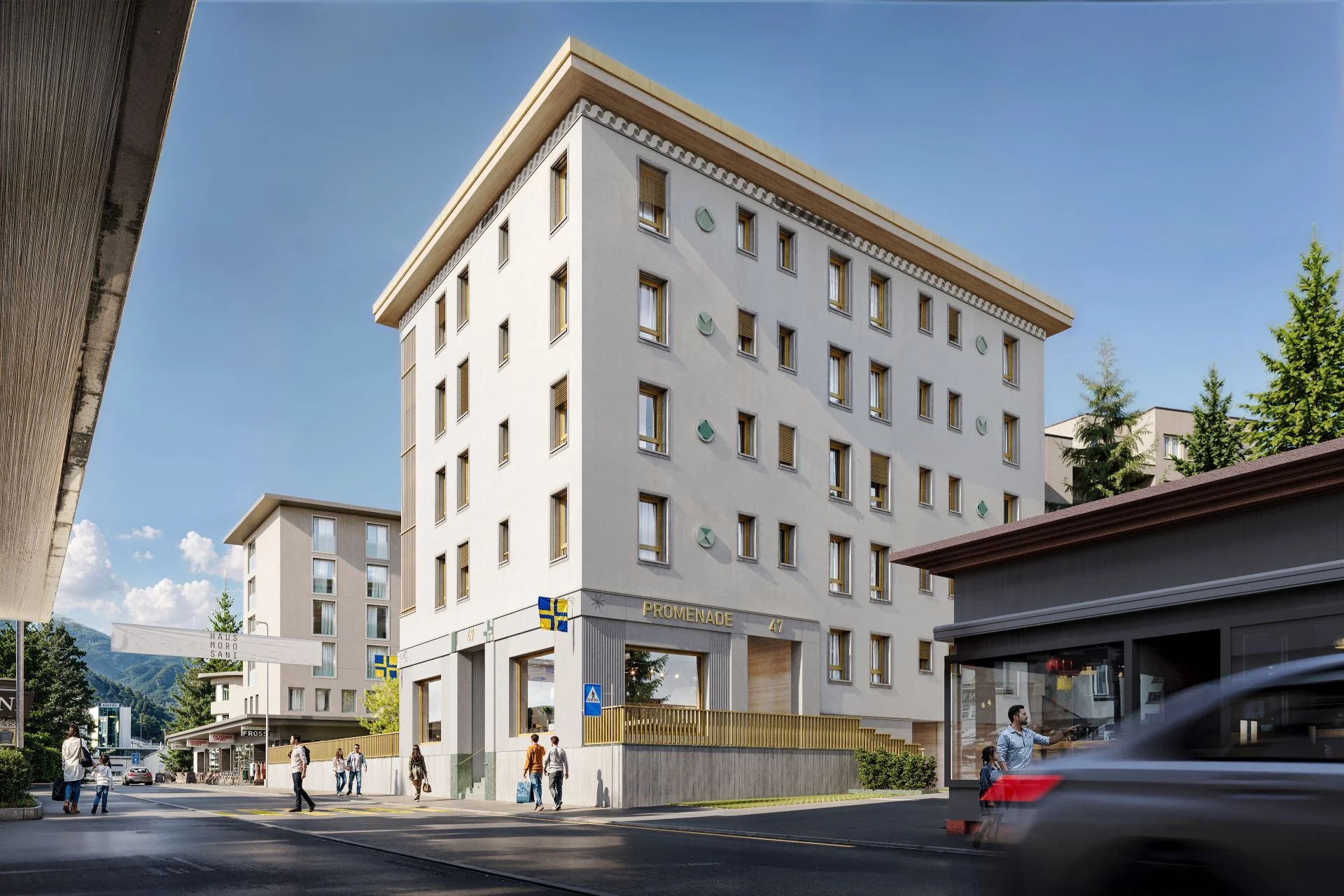 Städtisches Mehrfamilienhaus an einer Straße mit Alpenkulisse