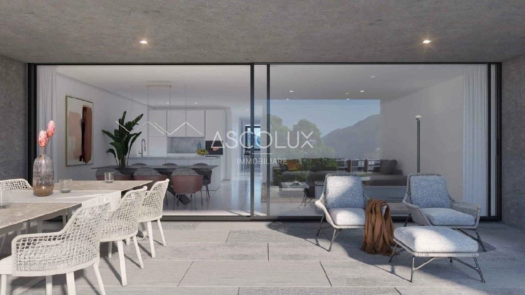 Moderne Terrasse mit Blick in den Wohnbereich