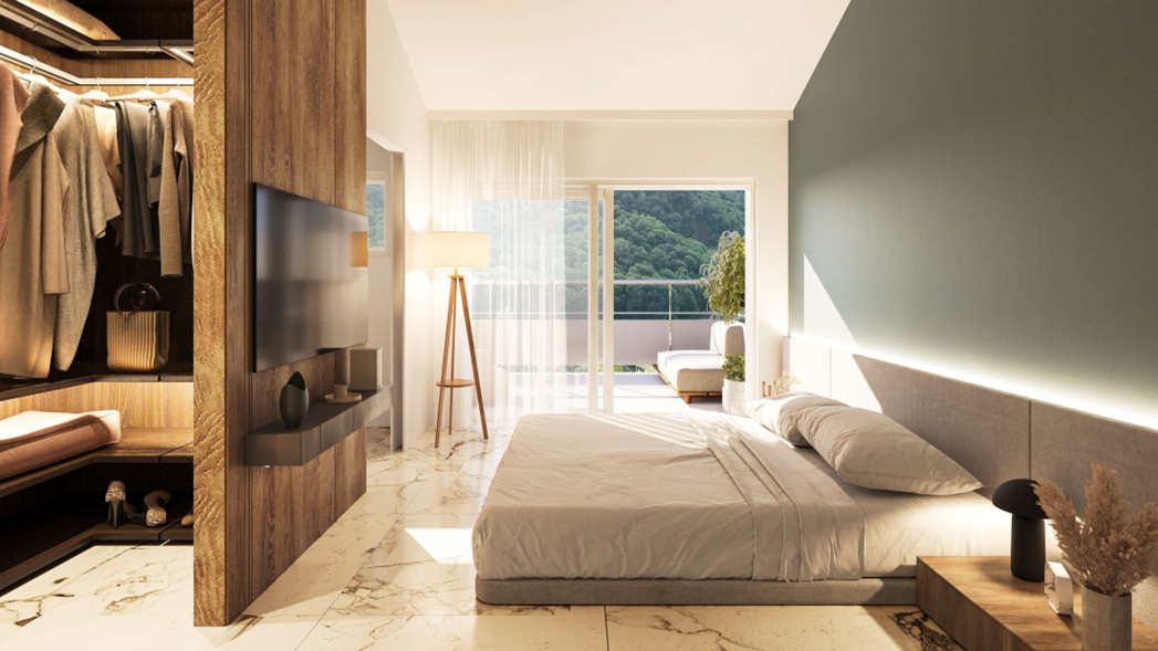Helles Schlafzimmer mit Ankleide und Balkonblick