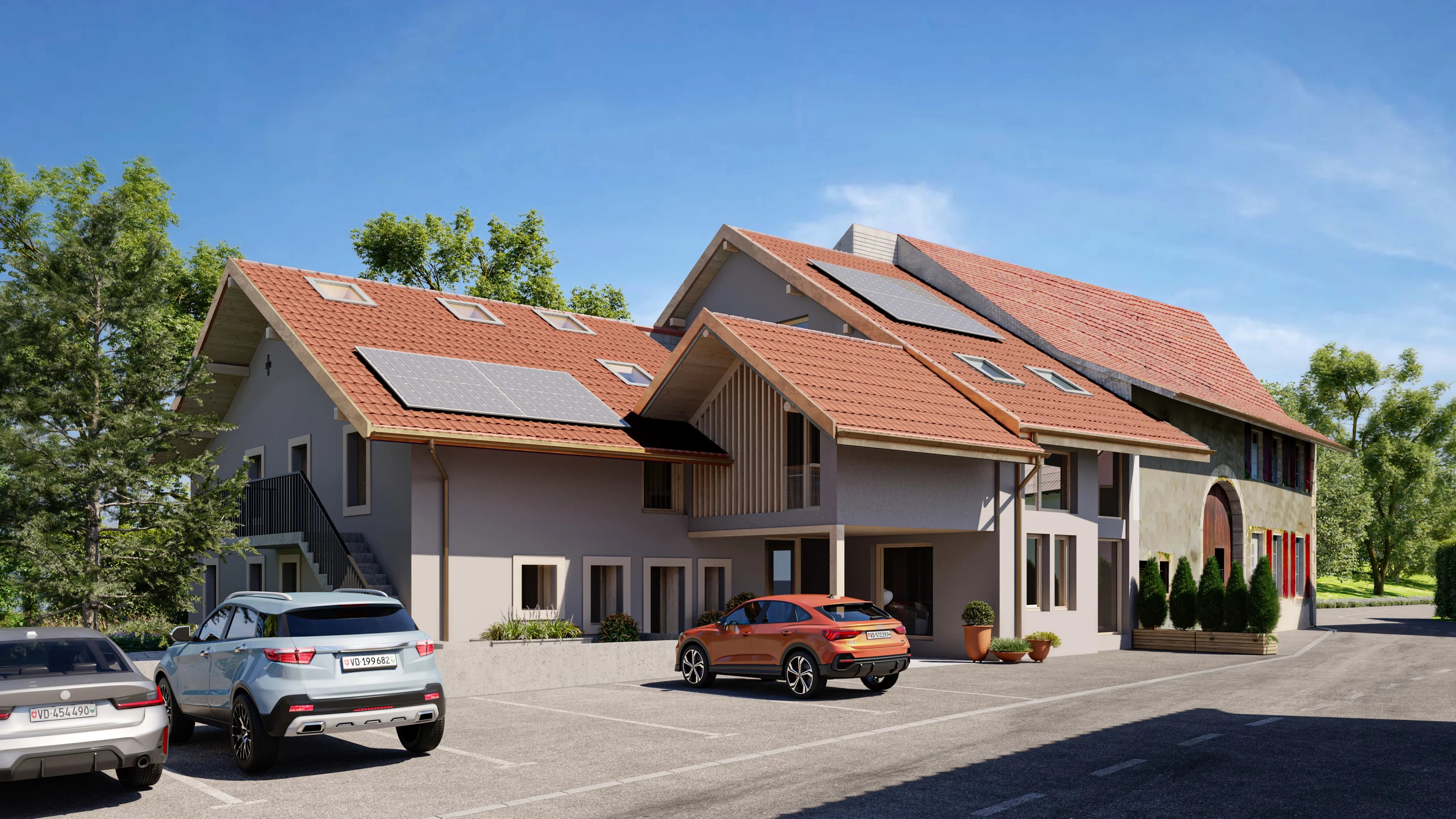 Außenansicht eines modernen Wohngebäudes mit Satteldächern und Solaranlage