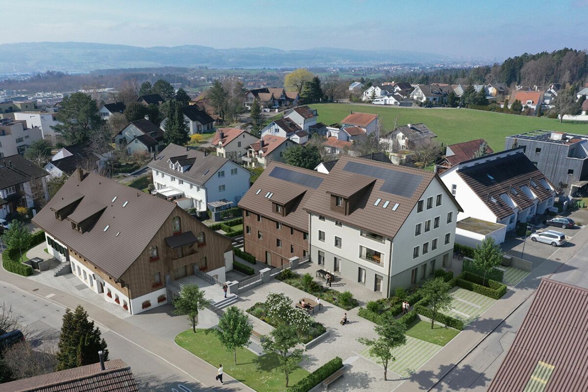 Luftaufnahme einer Wohnsiedlung mit mehreren Gebäuden