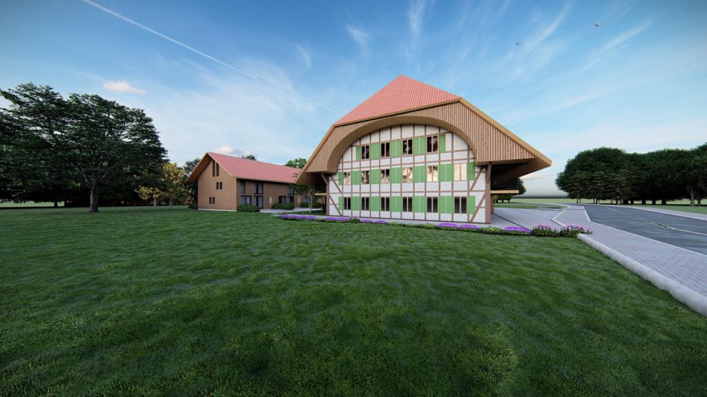 Ländliches Anwesen mit großem Giebelhaus und weitläufiger Rasenfläche