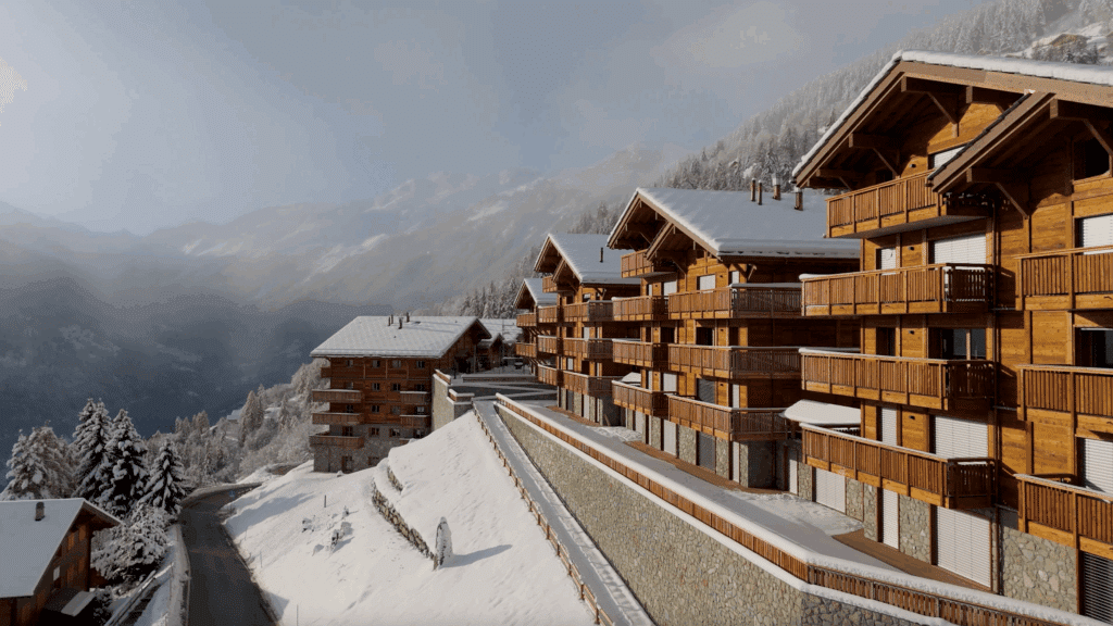 Alpenresort mit Holzchalets im Schnee