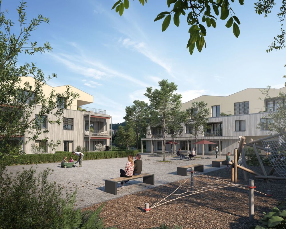 Innenhof einer modernen Wohnanlage mit Spiel- und Aufenthaltsbereichen