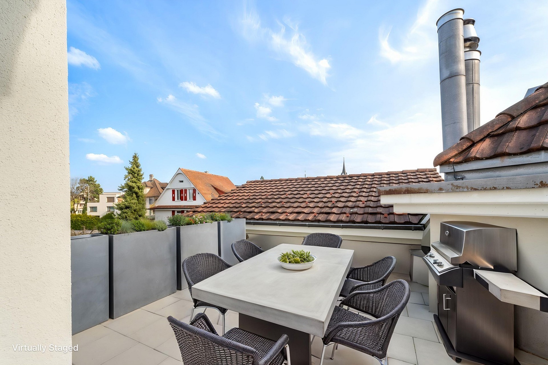 Dachterrasse mit Grill und Sitzgruppe