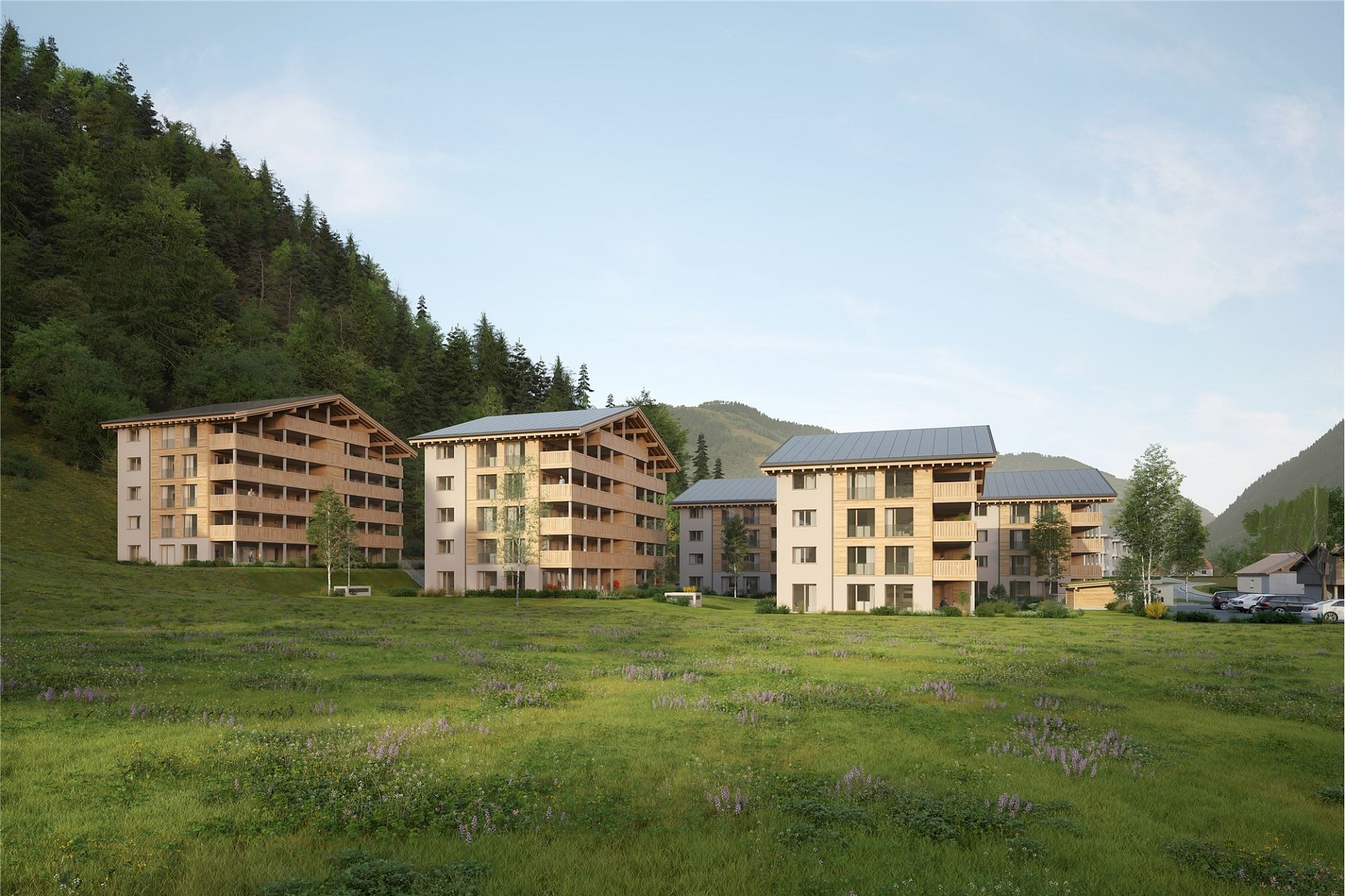 Alpine Wohnanlage mit Holz- und Putzfassaden