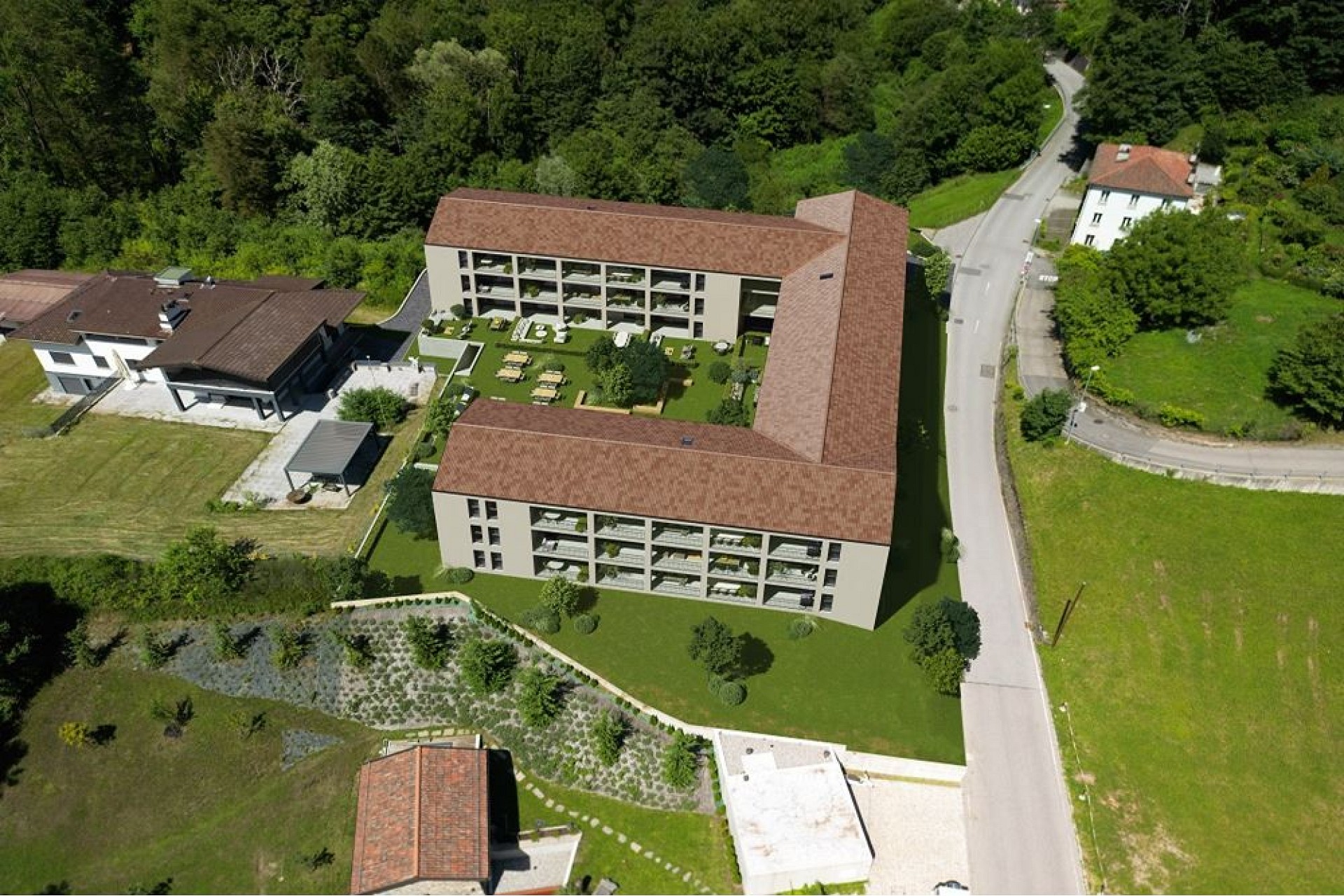 Luftaufnahme einer Wohnanlage mit Innenhof
