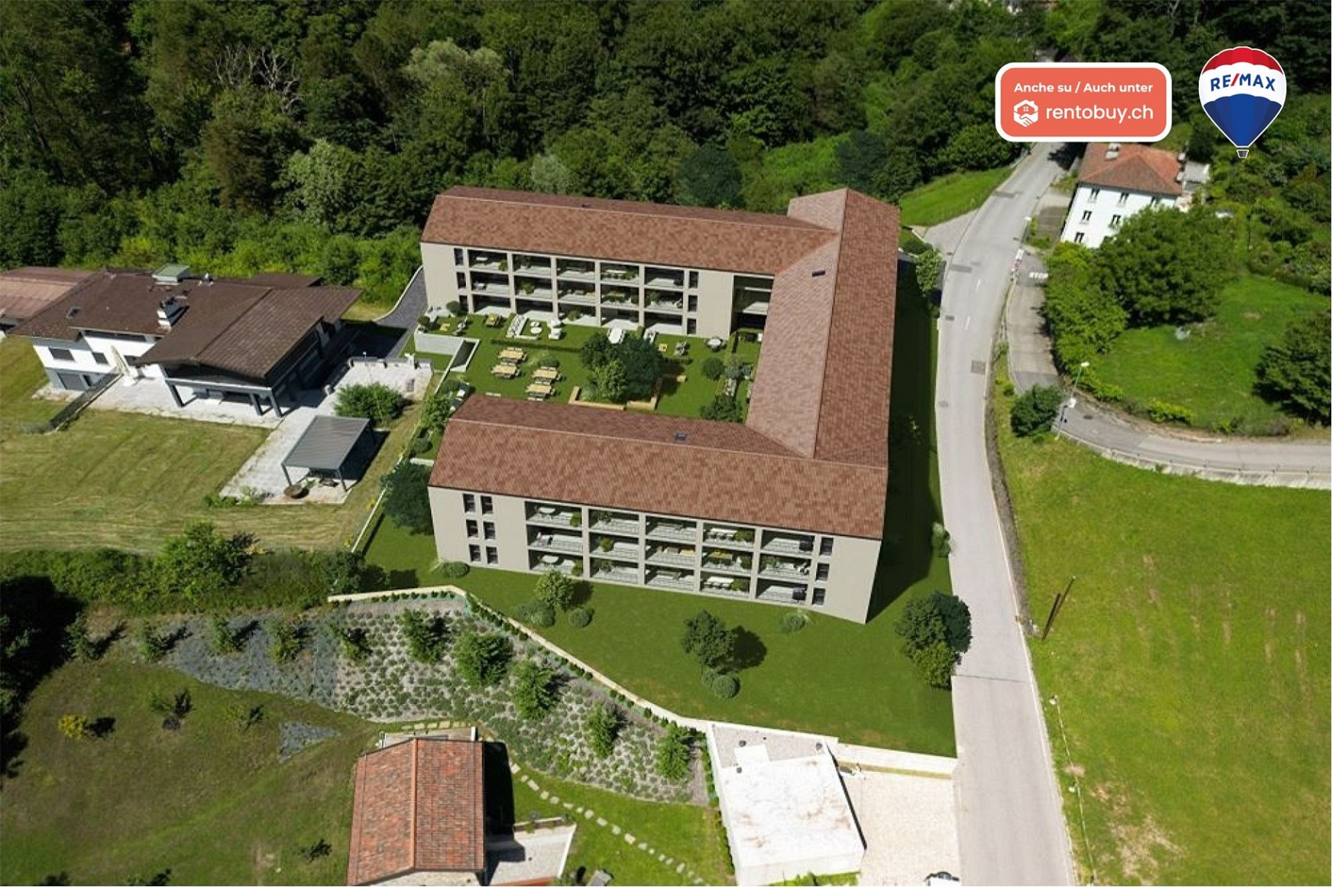 Luftaufnahme einer Wohnanlage mit Innenhof