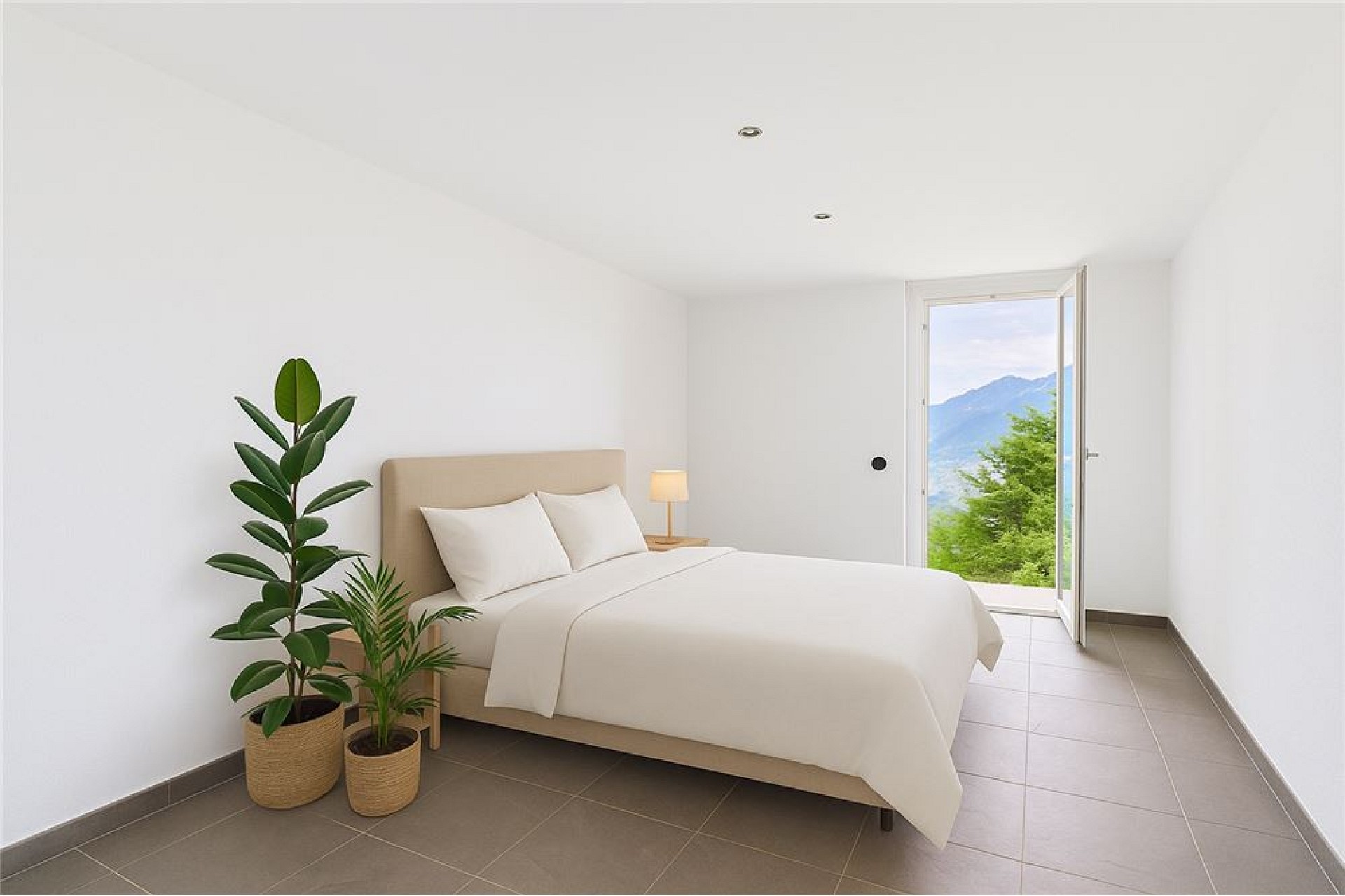 Helles, minimalistisch eingerichtetes Schlafzimmer mit Bergblick