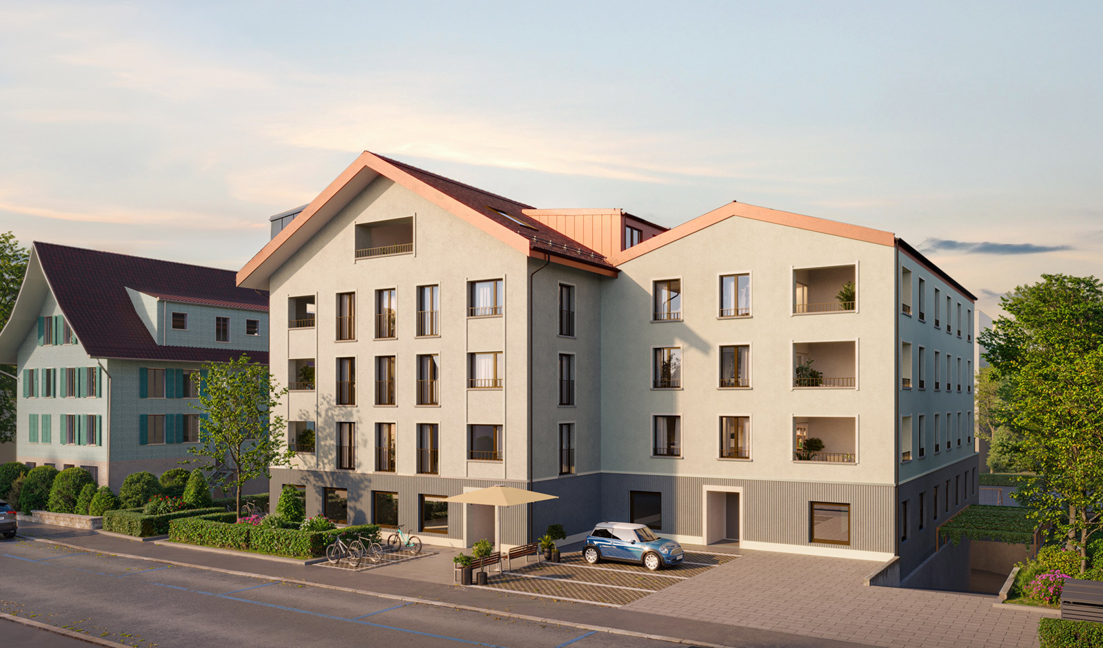 Mehrfamilienhaus mit Innenhof und Straßenansicht