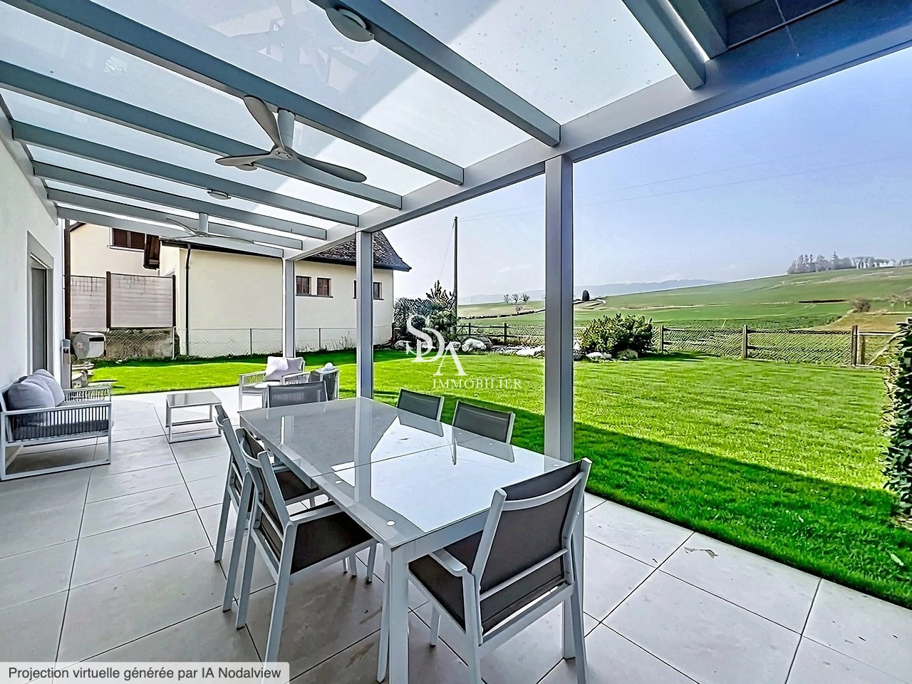 Überdachte Terrasse mit Garten- und Landschaftsblick