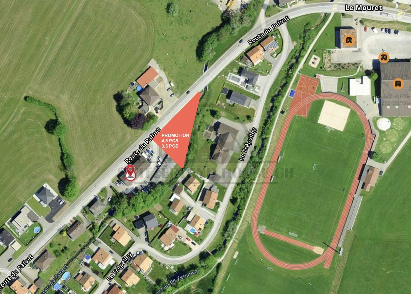 Luftbild eines Wohngebiets mit markiertem Baugrundstück