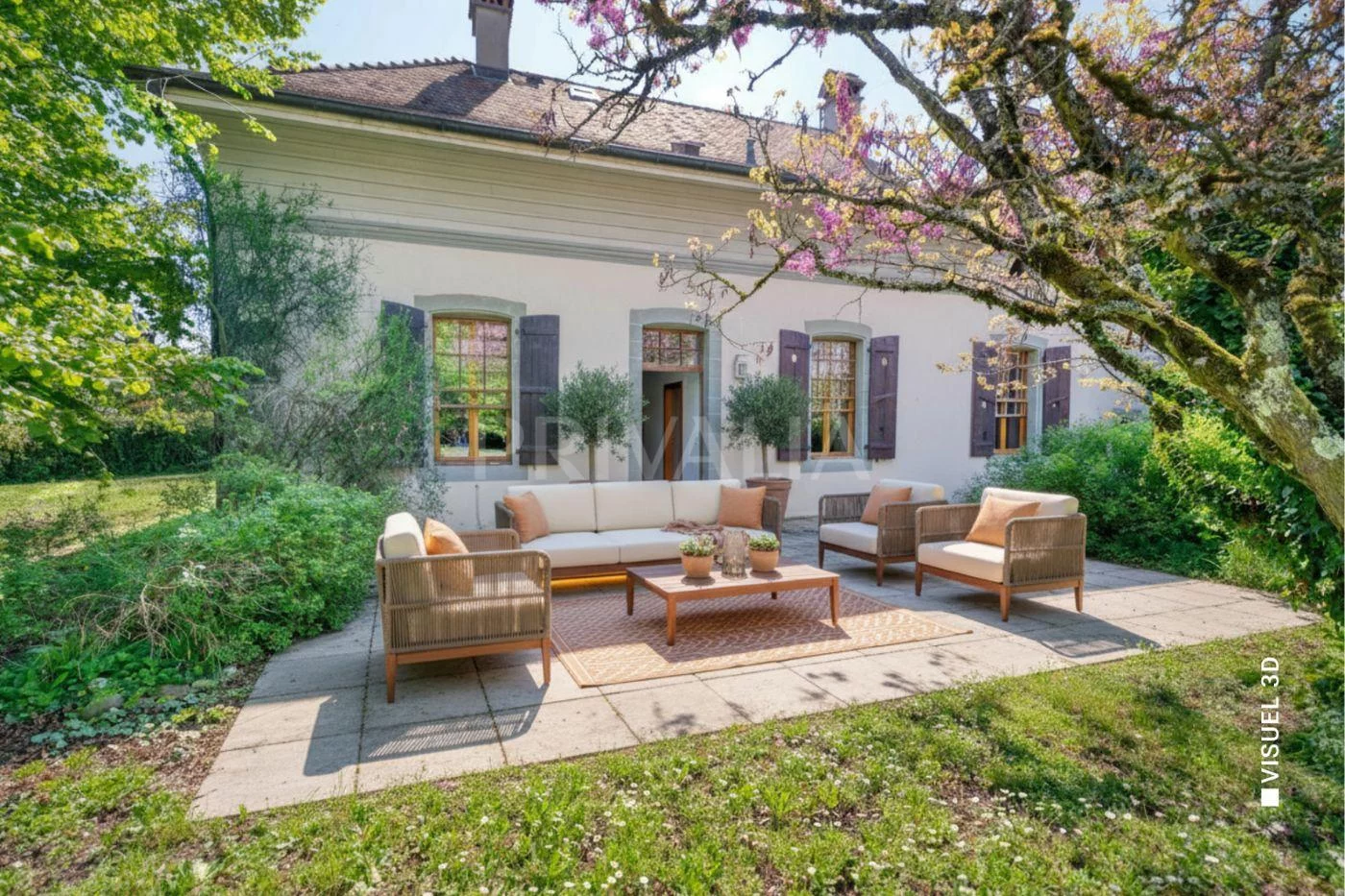 Gartenlounge vor einem Landhaus