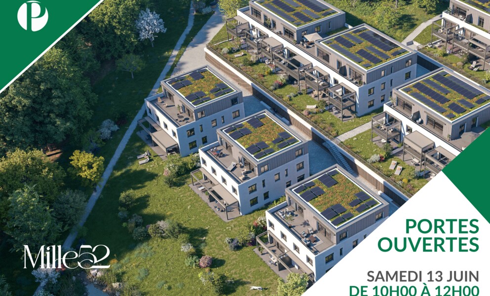 Luftaufnahme einer Wohnanlage mit Solardächern