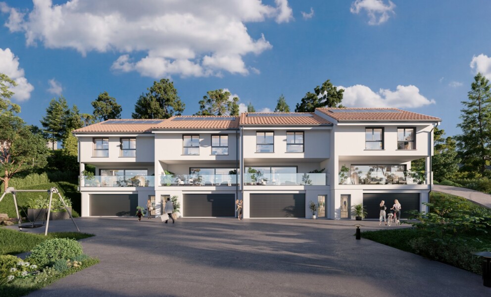 Modernes Mehrfamilienhaus mit Garagen und Balkonen