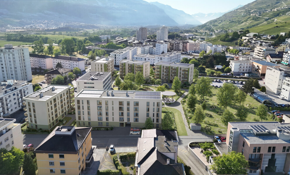 Luftaufnahme eines Wohnquartiers in alpiner Lage
