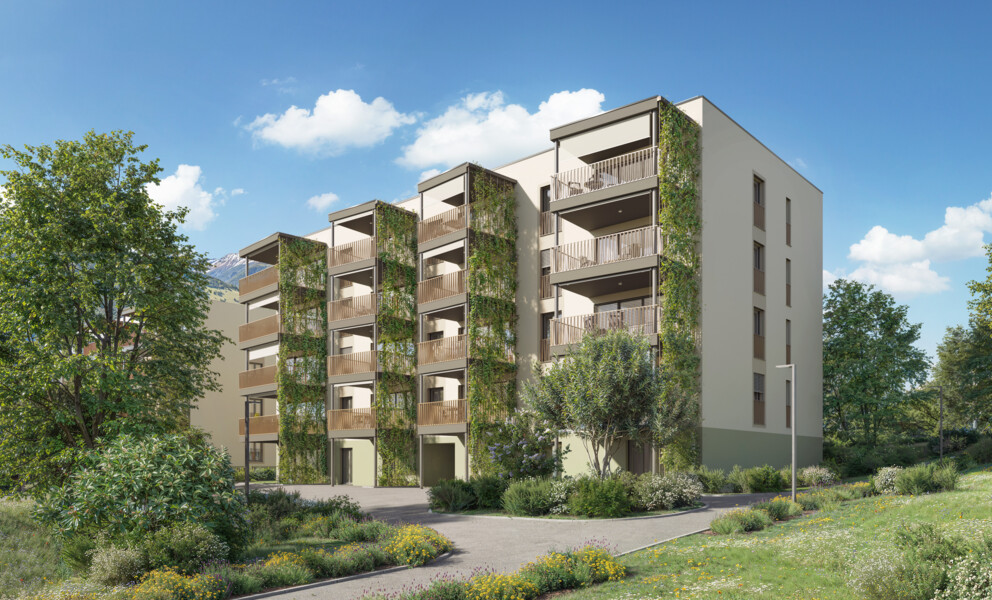 Modernes Mehrfamilienhaus mit begrünten Fassaden
