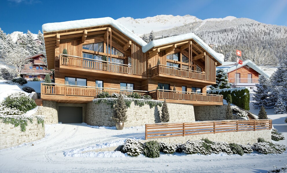 Schneebedecktes Holz-Chalet mit Alpenpanorama