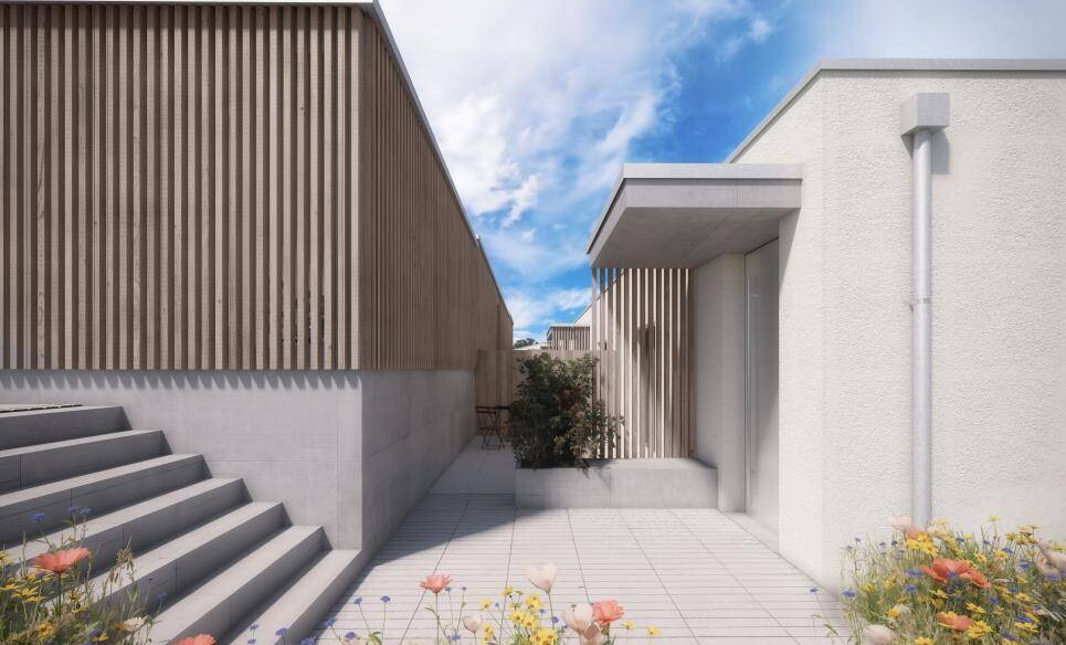 Außenbereich eines modernen Hauses zwischen zwei Baukörpern
