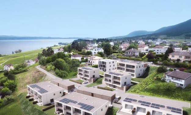 Luftaufnahme einer Wohnsiedlung am Wasser