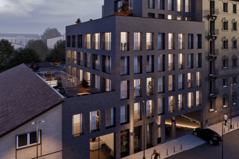 Moderne Wohnanlage mit Innenhof und beleuchteter Fassade