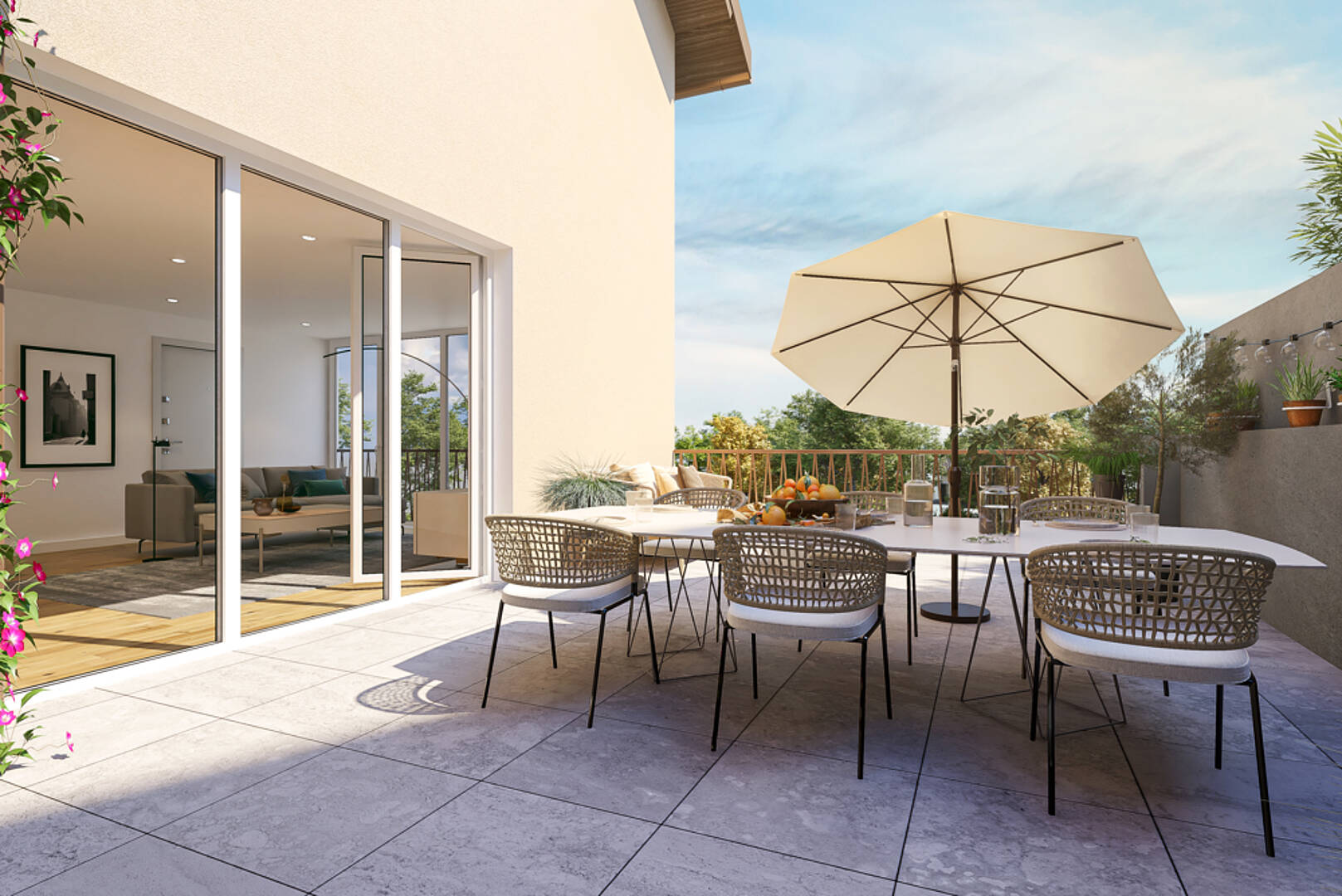 Terrasse mit Esstisch und Loungezugang