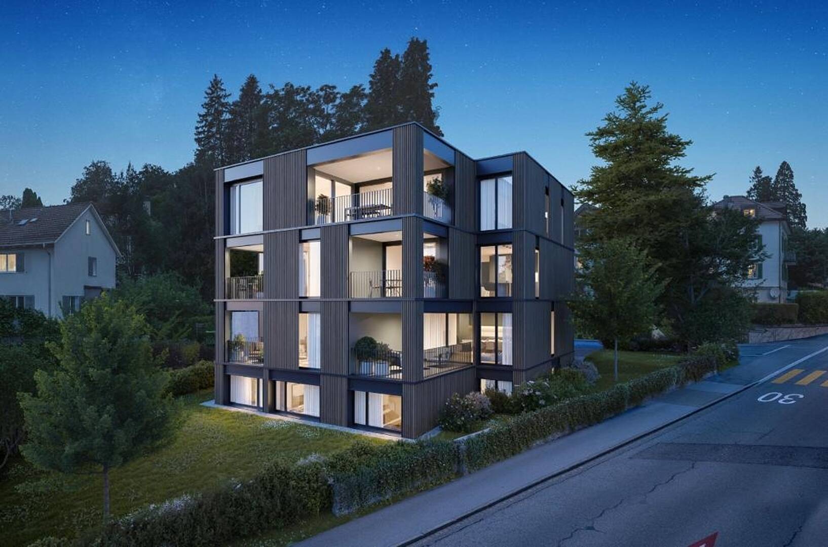 Modernes Mehrfamilienhaus in Abendstimmung