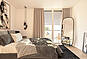 Schlafzimmer mit Doppelbett und bodentiefen Fenstern