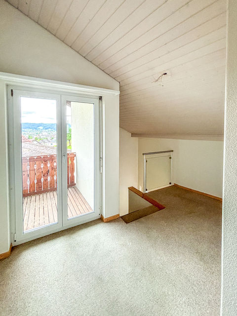 Dachzimmer mit Balkon
