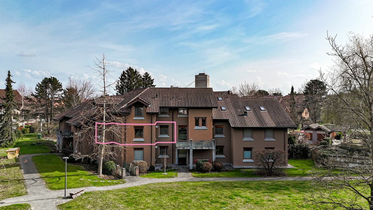 Mehrfamilienhaus mit Gartenansicht