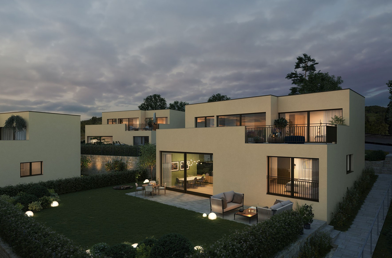 Moderne Wohnanlage mit Garten bei Abendstimmung