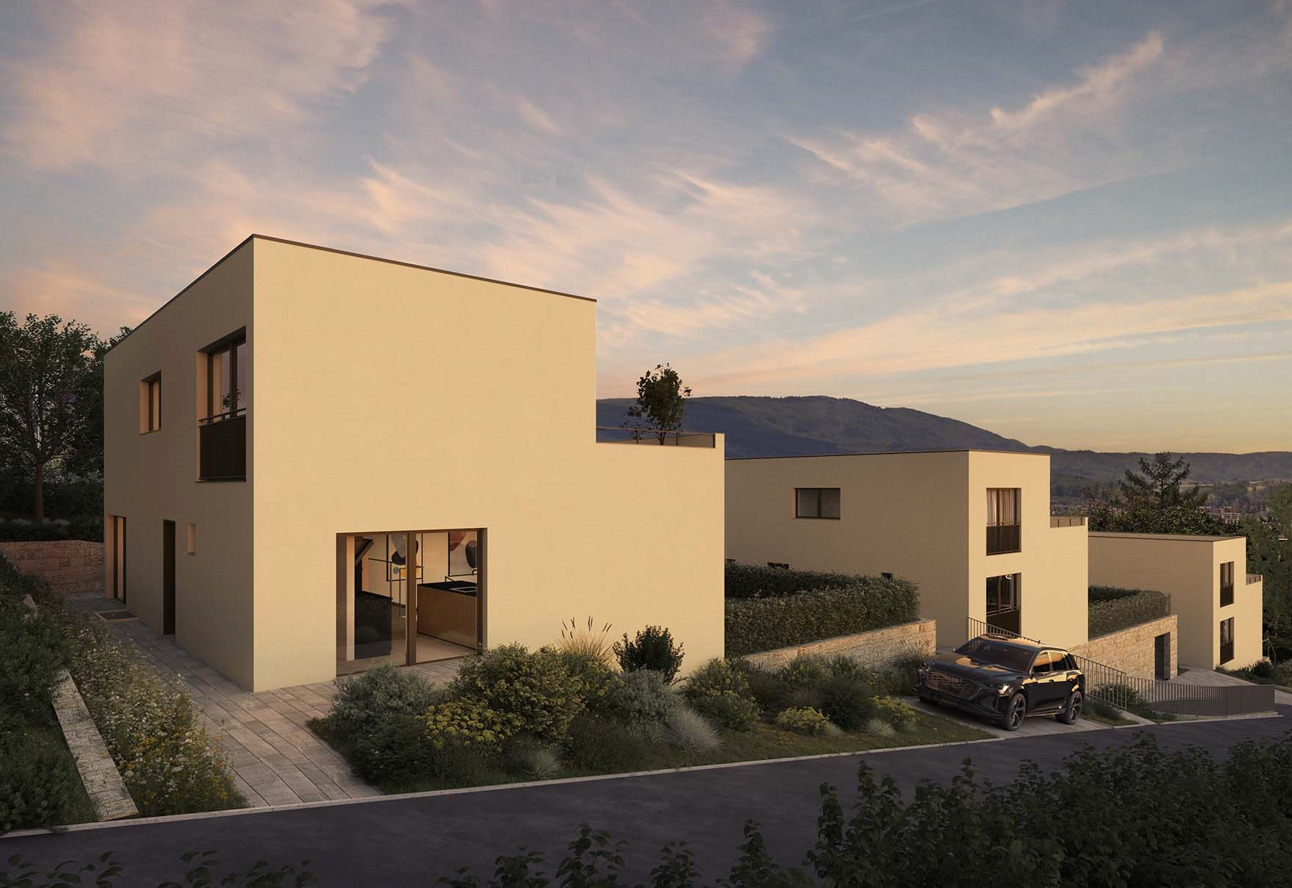 Modernes Neubau-Ensemble in Hanglage bei Sonnenuntergang