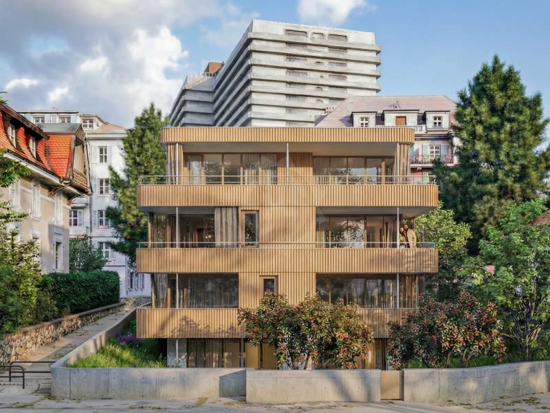 Modernes Mehrfamilienhaus mit Holzfassade